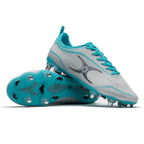 A pair of modern turquoise and white soccer cleats with plastic studs on the sole.