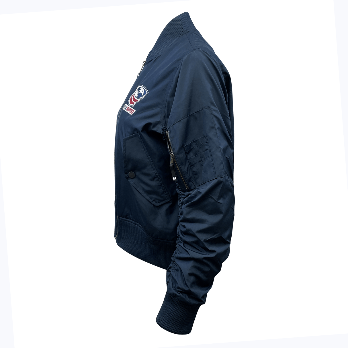 Navy blue Women's USA Rugby Flight Bomber Jacket by EMB Augusta features an embroidered chest patch, quilted storm flap for warmth, and a zippered sleeve pocket, side view.