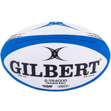 A blue and white rugby ball with "Gilbert" and "G-TR4000 Training Ball" printed on it, featuring advanced grip technology designed for optimal training sessions.