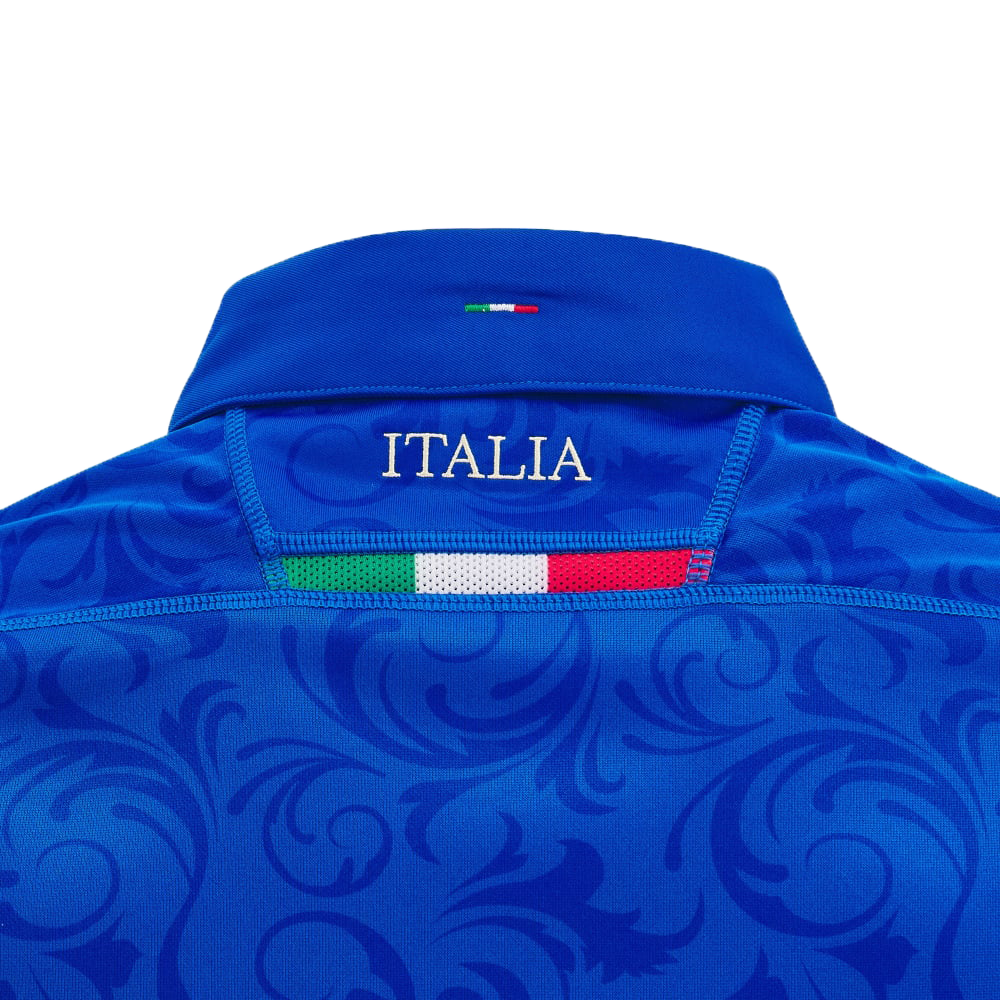 Introducing the Italy 24/25 Replica Home Jersey by Macron, featuring a blue design with "ITALIA" prominently displayed on the back, crafted from Eco Fightex Fabric and adorned with Italian flag colors on the collar.