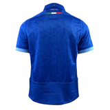 This is the back view of the Italy 24/25 Replica Home Jersey by Macron, showcasing blue hues with Renaissance-inspired graphic patterns and "ITALIA" text. A small Italian flag adorns the collar, highlighting its design crafted from Eco Fightex fabric for a sustainable style and performance.