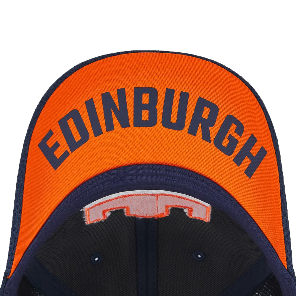 The Edinburgh Baseball Cap 24/25 by Macron is a stylish hat with an orange brim and "Edinburgh" boldly printed in black letters across the top.