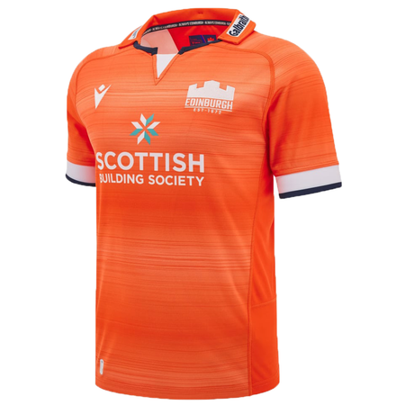 The Edinburgh Replica Away Jersey 24/25 by Macron is an orange sports jersey featuring white and navy trim, with "Edinburgh" and "Scottish Building Society" logos displayed on the front.