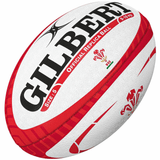 A Gilbert Wales Rugby Union Replica Ball with red and white design elements, ideal for any rugby enthusiast.