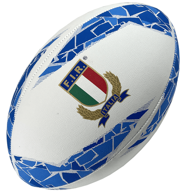 A white rugby ball with blue patterns and the Italian Rugby Federation logo centered, featuring a tricolor shield topped with "F.I.R." and a banner reading "Italia". The Italy Supporters Ball by Gilbert also proudly displays Gilbert branding.