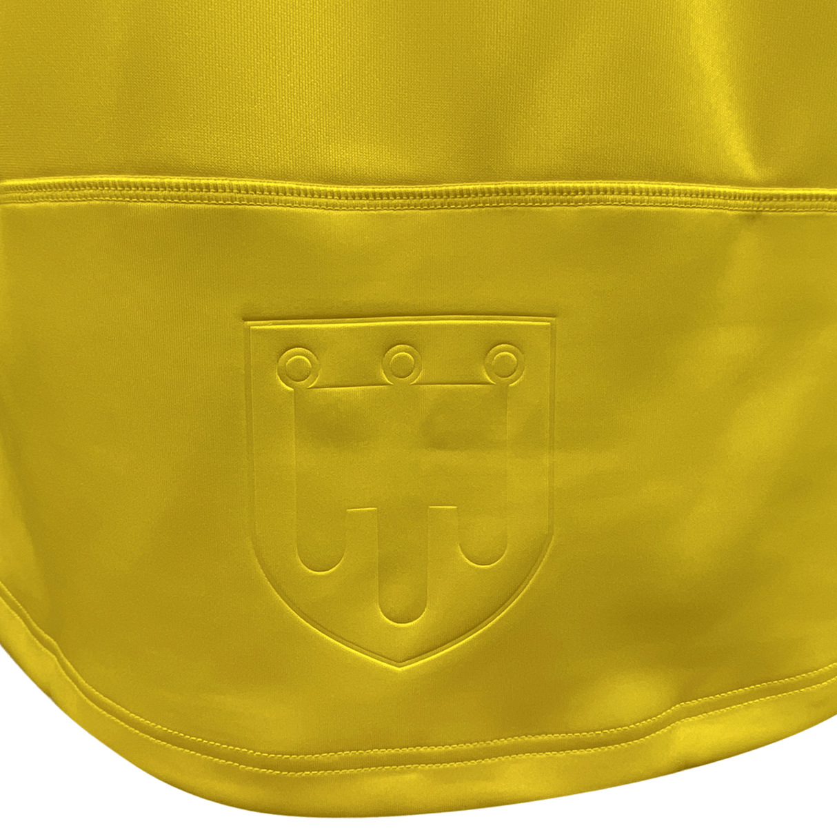 The back of a yellow ASM Clermont Auvergne Home Jersey 23/24 by Macron with a Macron logo on it.