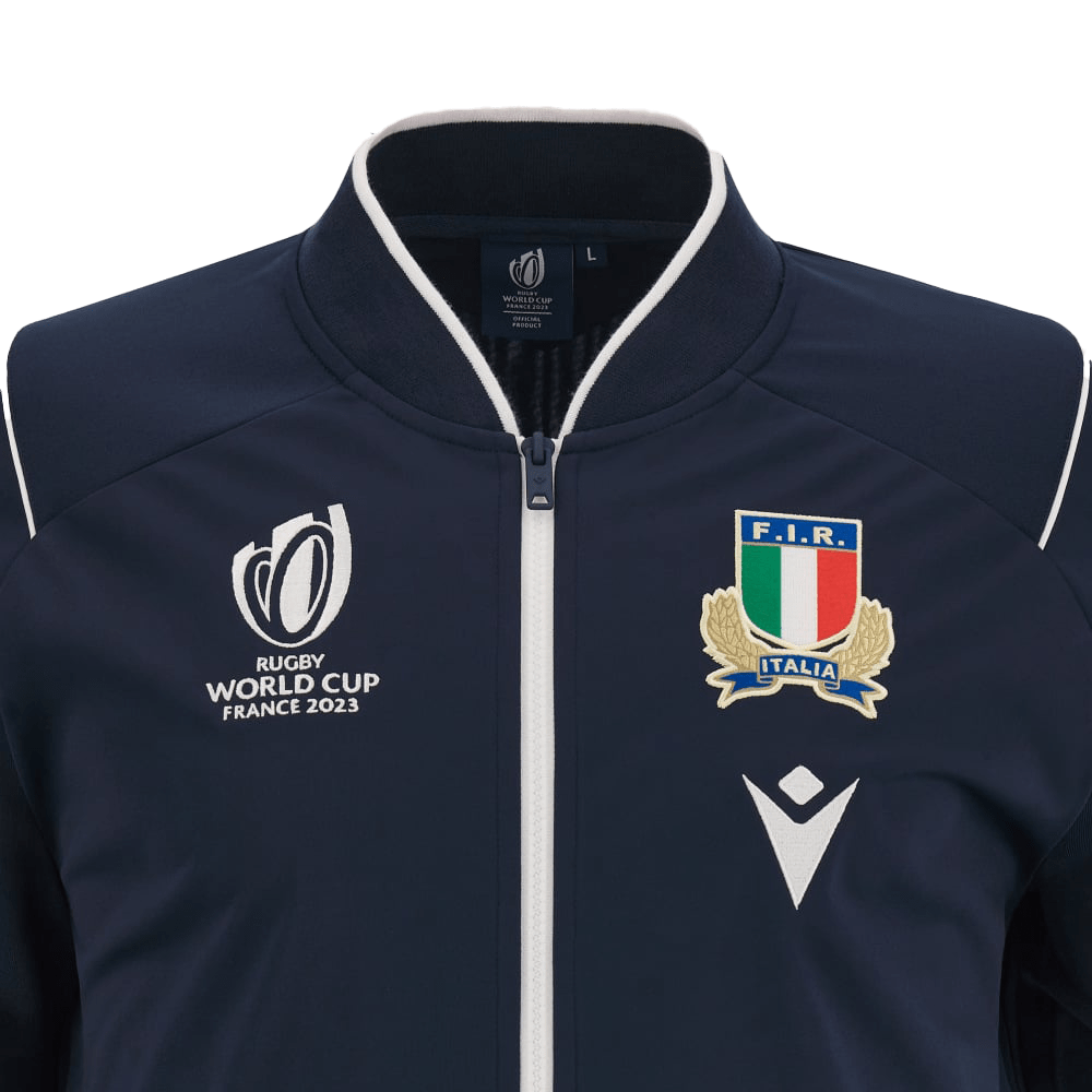 Close-up of the Italy RWC23 Full-Zip Anthem Jacket by Macron, showcasing the Rugby World Cup France 2023 logo on the left chest and the Italian Rugby Federation emblem on the right chest. This jacket epitomizes style and rugby pride.