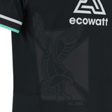 The Ospreys Home Jersey 23/24 by Macron is a black sports jersey with white and turquoise trim on the sleeves, featuring the "ecowatt" logo and a subtle outline of an eagle alongside the text "Est. 2003." This athletic-fit jersey is crafted from high-tech fabric designed for optimal performance.