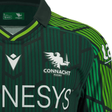 Close-up of the Connacht 23/24 Home Jersey by Macron in green and black, showcasing sponsor logos and a harp-winged creature logo on the chest. Made from eco fabric, this jersey beautifully blends sustainability with vibrant team spirit.