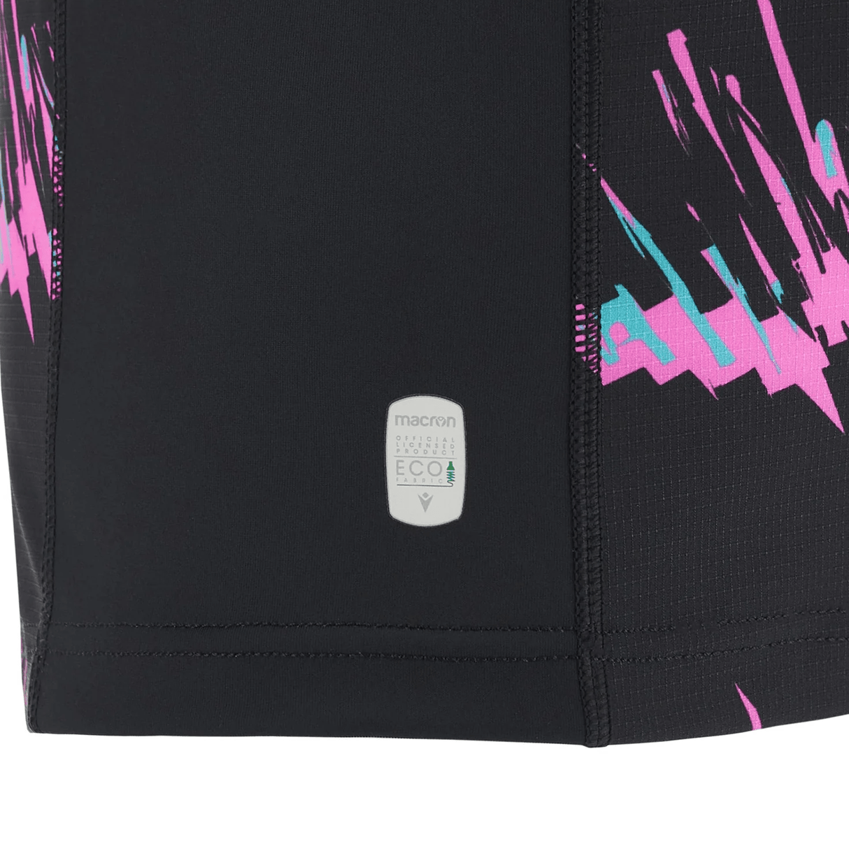 Close-up of a black Macron Barbarians 23/24 Training Jersey with a vibrant pink and blue splash design and a small 'macron eco-system recycle eco' logo patch.