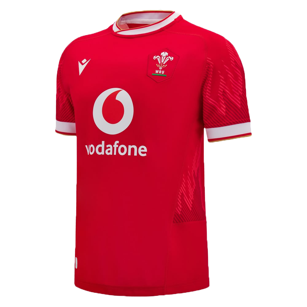 Discover the striking design of the Wales 6 Nations Replica Home Jersey 24/25 by Macron, a vibrant red rugby top showcasing the iconic "vodafone" logo and the proud Wales emblem on the chest. Highlighted with white details on the sleeves and collar, this Macron shirt is ideal for fans of the 6 Nations Replica Jersey.