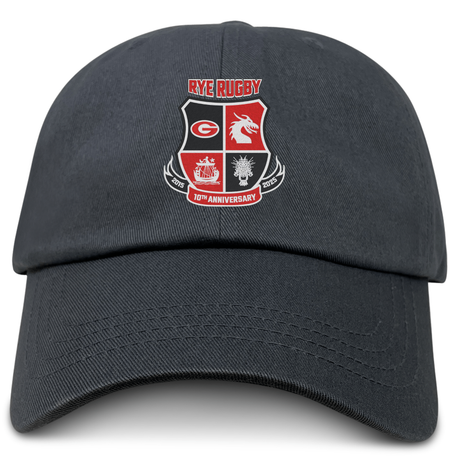 The Rye High School 10 Year Adult Low-Profile Cotton Twill Dad Cap from EMB Alpha Broder features embroidered team branding with the "Rye Rugby 10th Anniversary" logo, adorned with various emblems prominently displayed on the front.