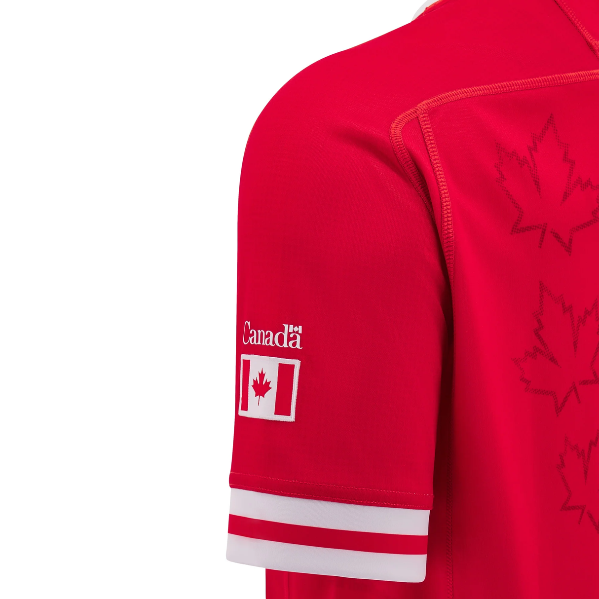 Close-up of the sleeve of the Canada 24/25 Home Jersey by Macron, highlighting the iconic Canadian flag and maple leaf designs. This jersey has just arrived, displaying national pride with every stitch.