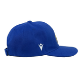 The Italy Baseball Cap 24/25 by Macron features a side view of the blue cap with a curved brim and an adjustable strap. Designed by Macron, this cap includes embroidered logos on the front and side, and it is recommended to hand wash it to maintain its quality.