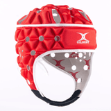 The Gilbert Air Headguard is a red and white rugby scrum cap featuring protective padding and ventilation holes. Branded with the Gilbert logo, this lightweight headguard provides excellent shock absorption for enhanced protection on the field.