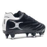 The Gilbert Icon 8S SG - Black is a black and white soccer cleat with metal studs, crafted from premium leather, featuring a stylized "X" symbol on the side.