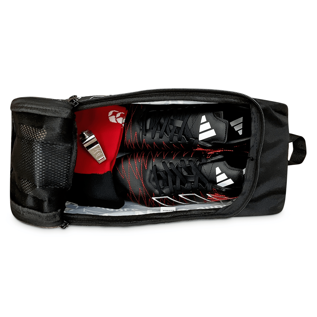 Black Focal Pro rugby boot bag with a pair of red and black sneakers and personal grooming items from World Rugby Shop.