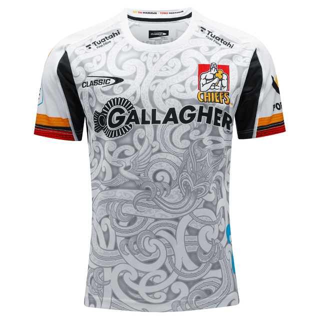 The Gallagher Chiefs Super Rugby Away Jersey 24 by Classic Sportswear is an intricately patterned black and white jersey, featuring prominent logos for Gallagher, Chiefs, and other sponsors on the front.