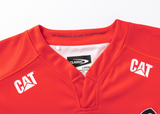 The Crusaders Super Rugby Replica Home Jersey 25/26 by Classic Sportswear features a red design with the "CAT" logo on both shoulders, a "CLASSIC" label inside, and text on the collar. Perfect for any Rugby fan, it embodies timeless Classic Sportswear design.