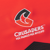 The Crusaders Super Rugby Replica Home Jersey 25/26 by Classic Sportswear features a stylized 'C' and the text "CRUSADERS" and "MĀ PANGO MĀ WHERO," perfect for any Super Rugby fan.