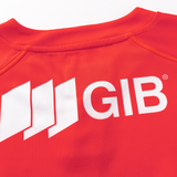 Close-up of a red sports jersey with the iconic white "GIB" logo on the back, embodying the Classic Sportswear style. This design mirrors the Crusaders Super Rugby Replica Home Jersey 25/26 by Classic Sportswear, reminiscent of thrilling Super Rugby matches.