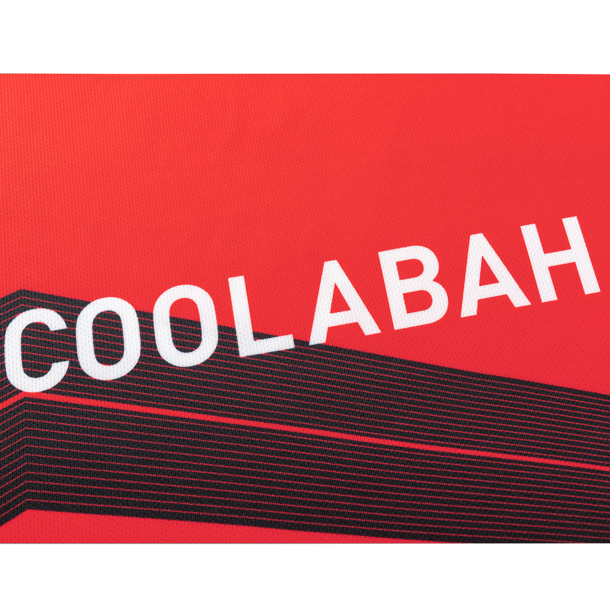 The Crusaders Super Rugby Replica Home Jersey 25/26 by Classic Sportswear features a red background with "COOLABAH" in white, similar to iconic sportswear, and black diagonal stripes beneath.