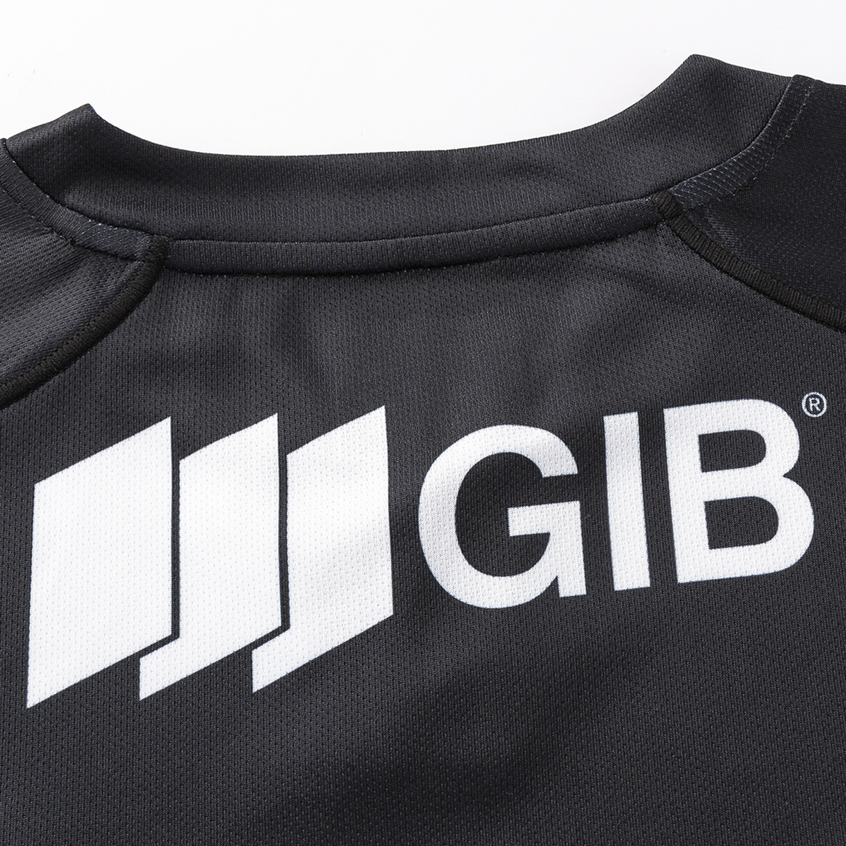 This black shirt, reminiscent of the timeless Crusaders Super Rugby Replica Away Jersey 25/26 by Classic Sportswear, features a white "GIB" logo and three stacked bars on the back.