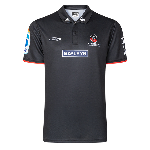 The Crusaders Super Rugby Team Polo 25/26 by Classic Sportswear, made from moisture-wicking fabric, showcases embroidered Bayleys and Crusaders logos on the front and sleeves.