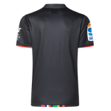 The back view of the Crusaders Super Rugby Team Polo 25/26 by Classic Sportswear highlights a black sports jersey made from moisture-wicking fabric, with colorful trim on the hem and sleeves, and embroidered sponsor logos.