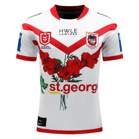 A white rugby jersey with red accents featuring the St George Illawarra Dragons logo, a red flower design, a green dragon graphic, and sponsor logos. This Dragons NRL Heritage Jersey by Classic Sportswear is part of the Official NRL Merchandise for the St. George-Illawarra Dragons 2023 season.