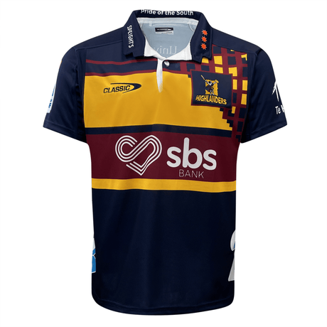 A colorful Highlanders Super Rugby Heritage Jersey by Classic Sportswear, featuring sponsor logos and a pattern of red, yellow, and navy blue.