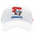 The Knights NRL 25/26 Media Cap by Classic Sportswear is a quick-drying polyester cap featuring a white design with a stylized knight helmet and red plume. "KNIGHTS" is embroidered below, and it includes an adjustable Velcro closure for the perfect fit.