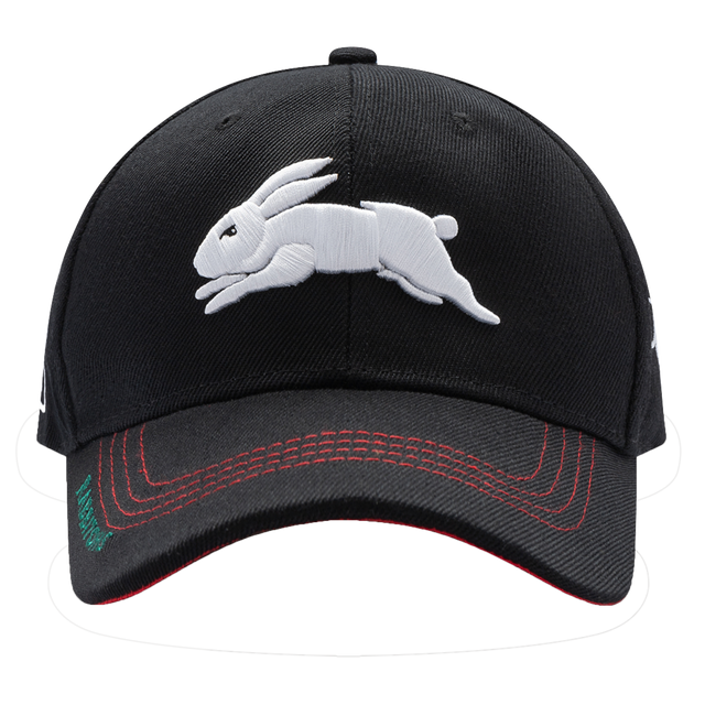 The Rabbitohs NRL 2025 Media Cap by Classic Sportswear showcases a sleek black design with an embroidered white rabbit on the front and red stitching on the visor. Crafted from quick-drying polyester, it ensures both comfort and convenience with its adjustable Velcro closure for a perfect fit.