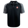 The Chico Oaks Elite Polo by EMB Canterbury is a black and gray short-sleeve shirt made with Vapodri fabrics for lightness and durability, featuring a small red and white emblem on the left chest.