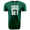 Just In: WRS LAT's Crouch Bind Set Supersoft Tee from the 99 Collection features a green t-shirt with bold white text saying "CROUCH BIND SET" and an image of a rugby scrum in the center, offering both comfort and style.