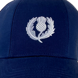 Ellis Rugby's Scotland Rugby 1990 Vintage Cap features a navy blue design with an embroidered white thistle emblem on the front, evoking memories of the iconic 1990 match.