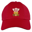 Wales Rugby 1976 Triple Crown Cap by Ellis Rugby, featuring a red design with embroidered "ICH DIEN" text and a crest that includes three white feathers above a gold crown, celebrating the legendary 1976 Triple Crown period in Welsh rugby history.