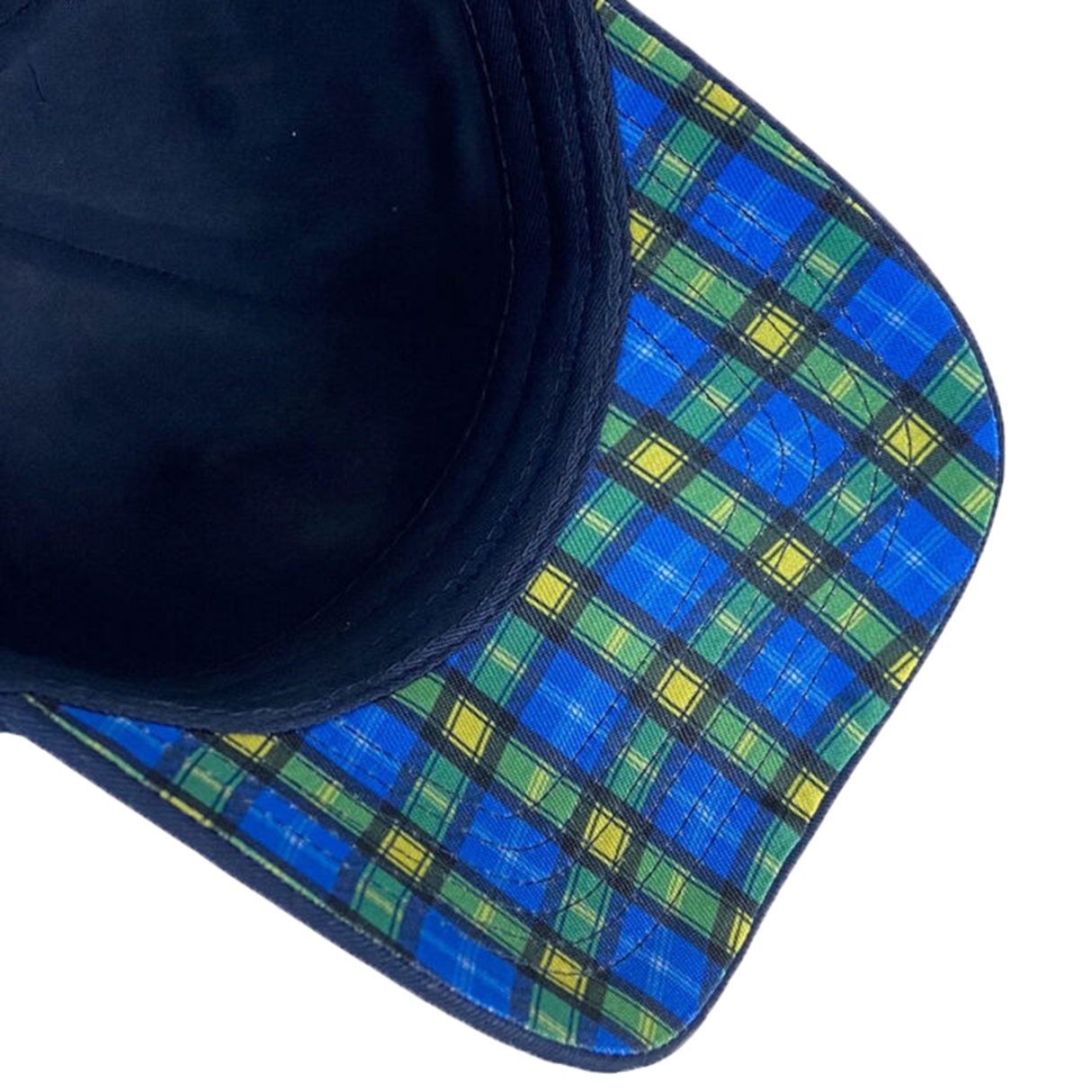 The image displays the underside of the Doddie Weir Scotland Cap by Ellis Rugby, highlighting a blue and green plaid pattern on its brim.