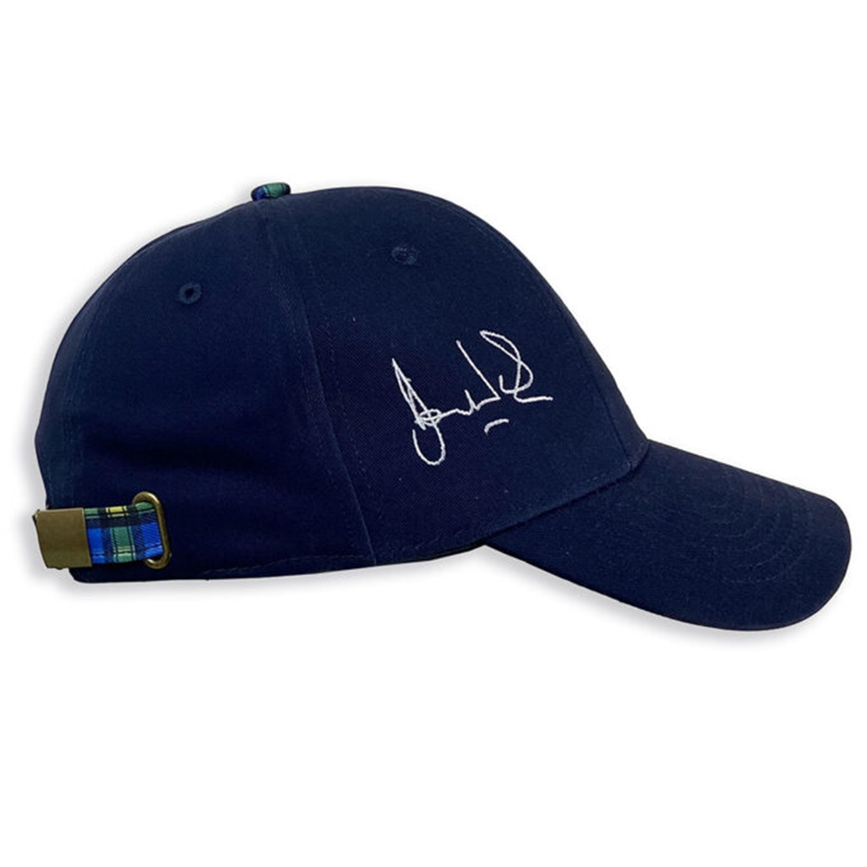 The Doddie Weir Scotland Cap by Ellis Rugby is a navy blue baseball cap adorned with a white signature on the side, and it features a plaid strap at the back, reflecting Ellis Rugby's sophisticated style.