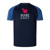 A navy blue rugby jersey with blue short sleeves features a red eagle graphic and the text "Rugby East" in white on the front. Crafted with Vapodri fabrics, this lightweight and durable Rugby East Conference Elite Training Tee by Canterbury offers both comfort and style by WRS Canterbury.