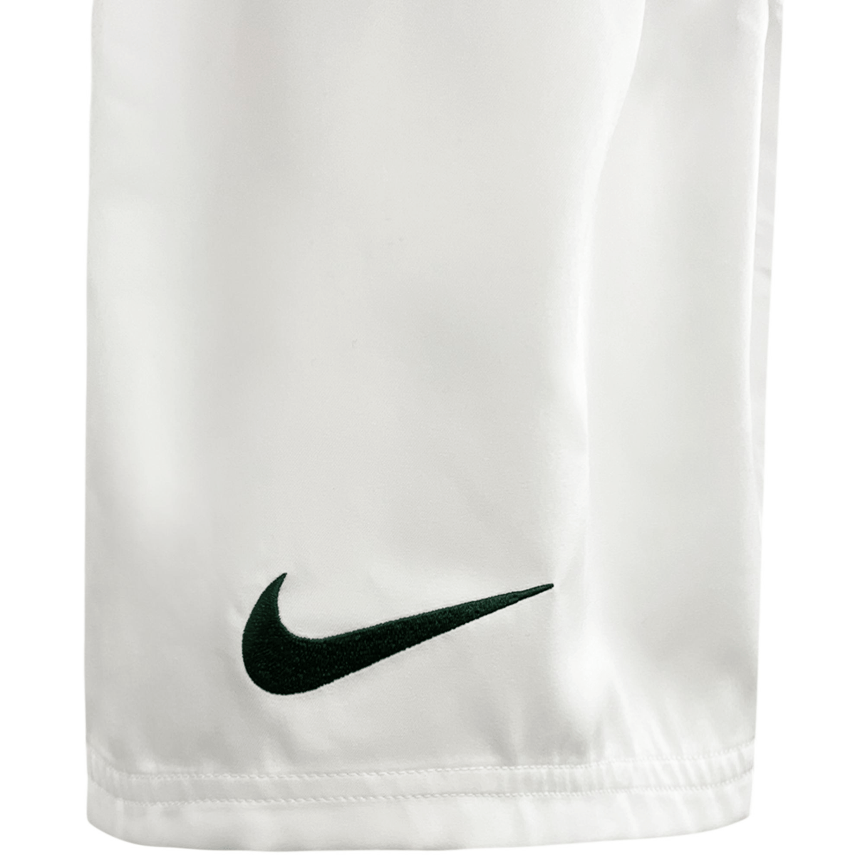 A white and green Springboks Replica Home Rugby Short 23/24 by Nike with the Nike logo on it.