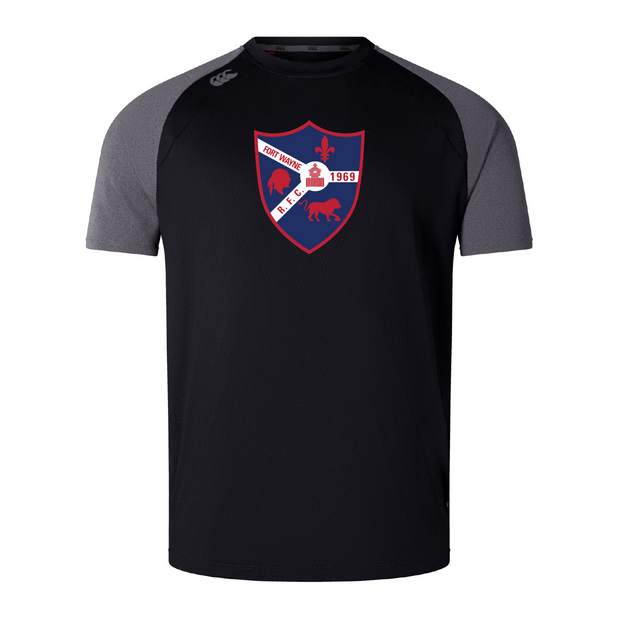 This black and gray tee from WRS Canterbury, inspired by the Fort Wayne Rugby Elite Training Tee, showcases a red and blue shield logo with a white diagonal band, fleur-de-lis emblem, and "Fort Worth R.F.C. 1969" text, crafted with Vapodri fabrics for lightweight comfort.