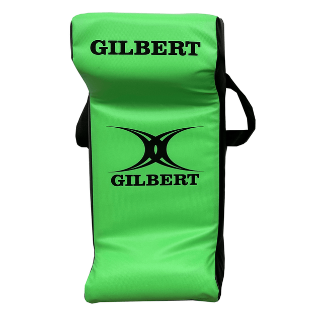 A green and black Hadar Gilbert Junior Rugby Green Tackle Wedge, adorned with the Gilbert logo and text, serves as essential rugby training equipment for honing skills.