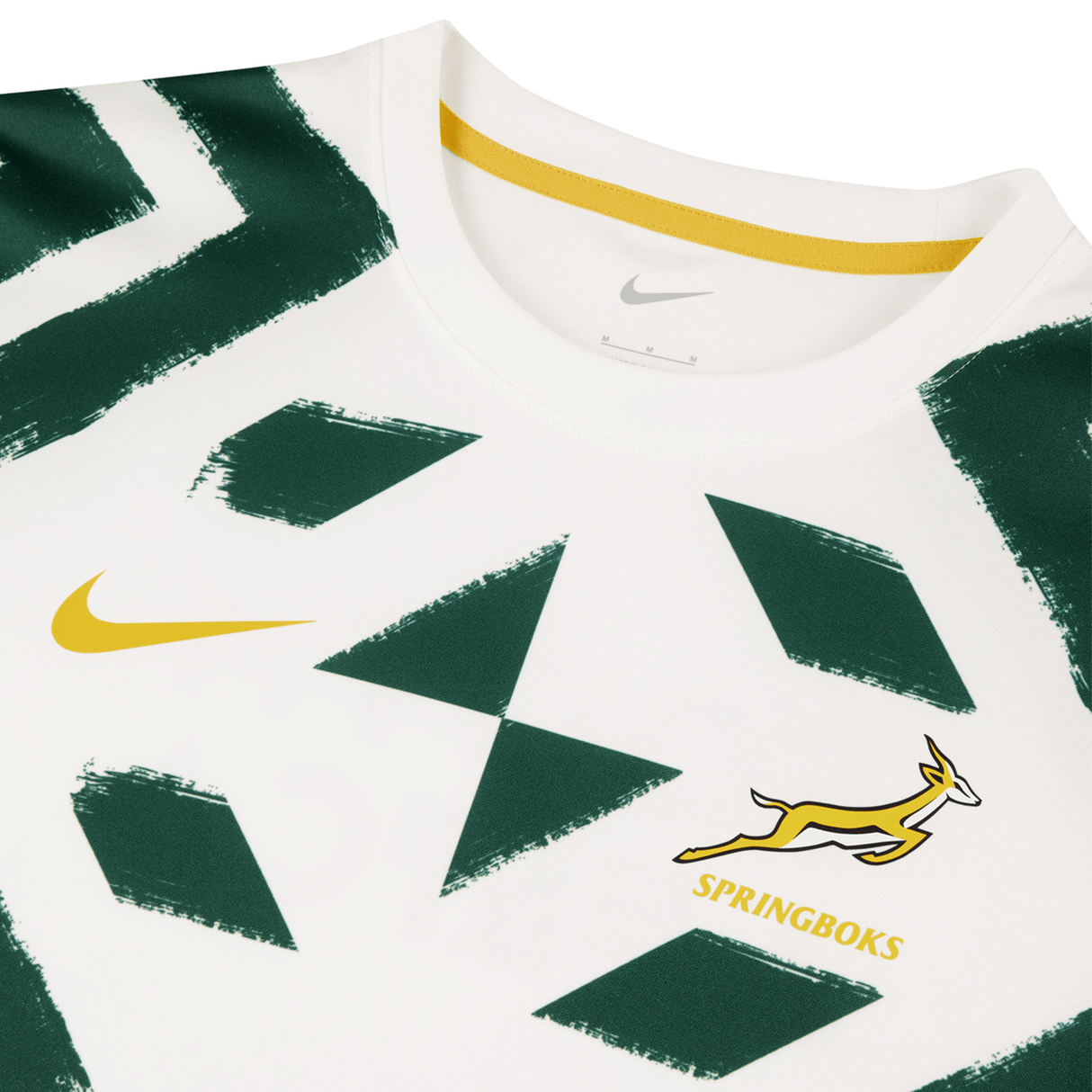 A Springboks Pre-Match Top by Nike, featuring a white base with green geometric patterns, a yellow swoosh logo on the left, and a leaping springbok with the word "SPRINGBOKS" on the right.