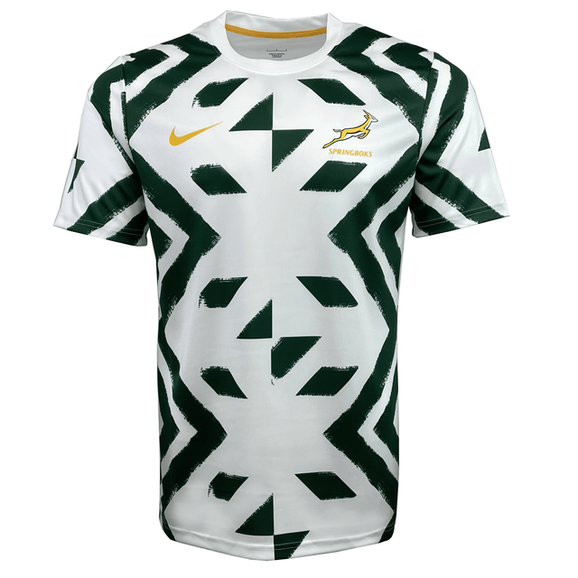 The Springboks Pre-Match Top by Nike is a white top featuring green geometric patterns, a yellow Nike logo on the chest, and a proud Springboks emblem on the opposite side.