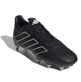 The adidas Kakari Elite SG '23 in Core Black, White, and Carbon is angled on a white background. This soft ground rugby cleat features six metal studs, laces, and incorporates recycled materials for an eco-friendly edge.