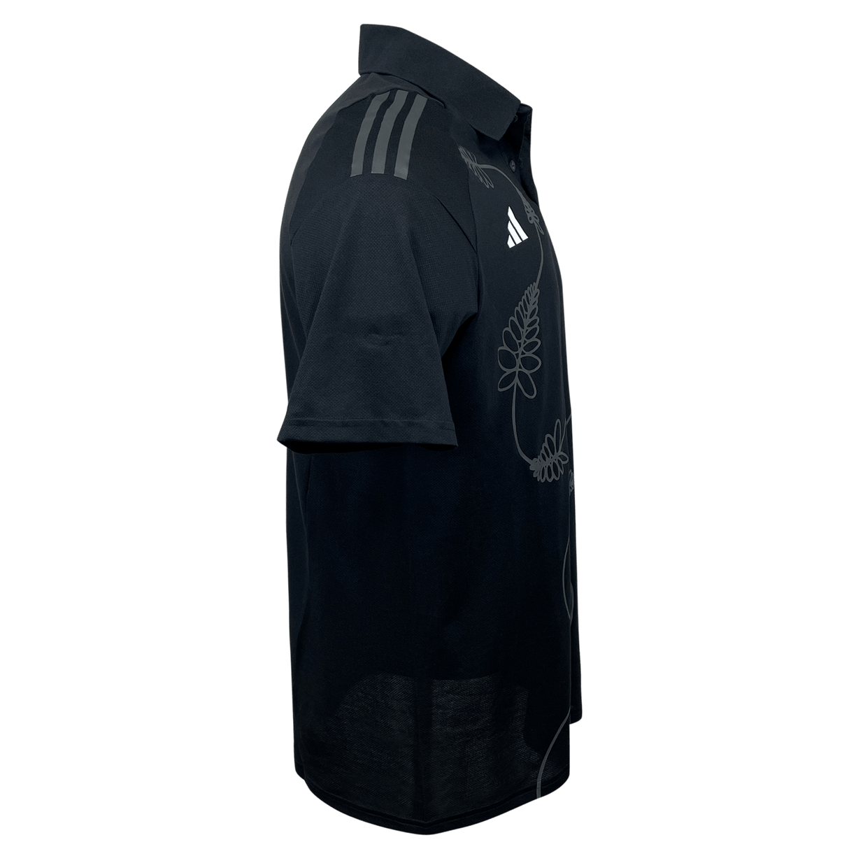 An adidas All Blacks Polo shirt in black, featuring a French Fern design on the side and diagonal stripes on the shoulder with the iconic adidas logo.