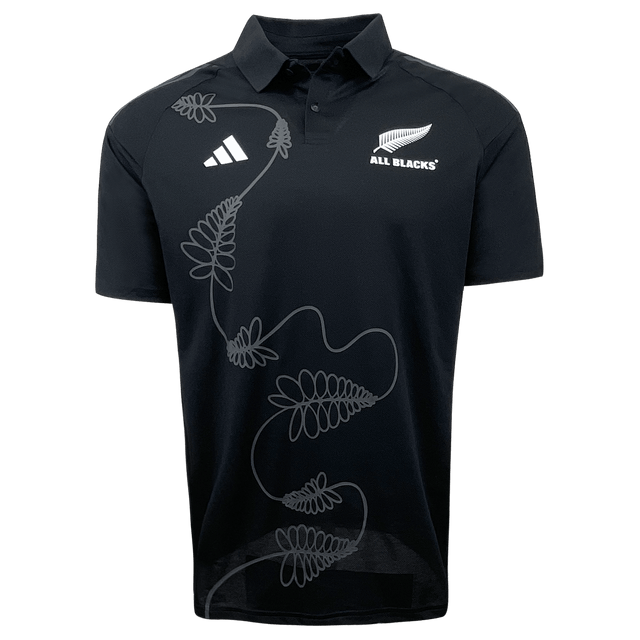 The All Blacks Polo by adidas showcases the adidas logo, "All Blacks" team name, and an intricate French fern design on the front.