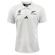 The All Blacks RWC 23 Away Supporter Jersey by adidas is a white collared rugby shirt styled as a replica match jersey, featuring the "World Cup France 2023" and "All Blacks" logos on the chest, with the adidas logo prominently displayed in the center.