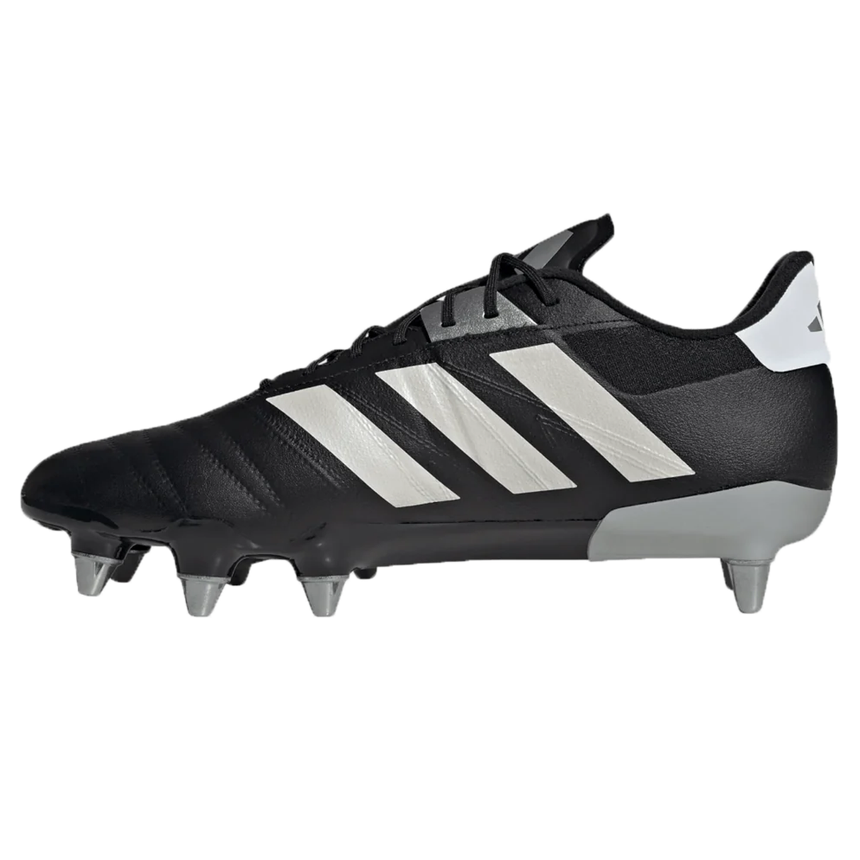 The adidas Kakari RS SG in Core Black, Zero Metallic, and Gold Metallic is a sleek soccer cleat crafted from Fasttech material for enhanced performance. It features metal studs and three iconic white stripes on the side.